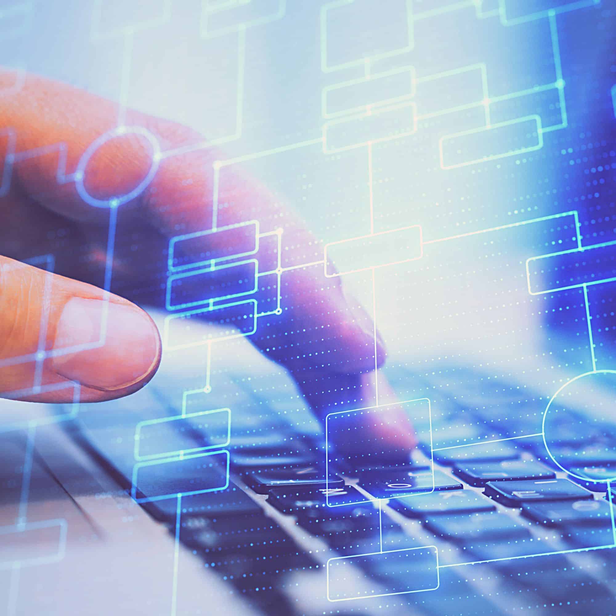 Close up of someone typing on a computer keyboard. The image is overlaid with transparent flowchart to represent data systems or data organisation.